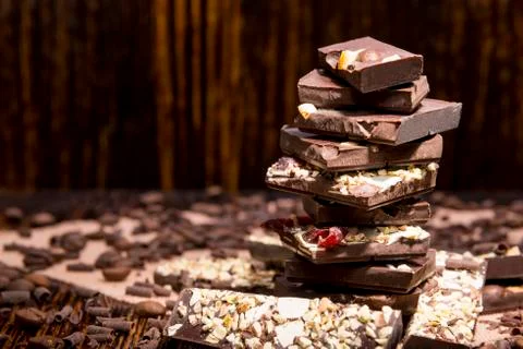 Stack of chocolate on a wooden background Stock Photos
