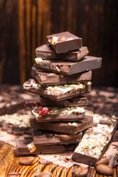 Stack of chocolate on a wooden background 스톡 사진