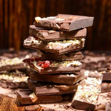 Stack of chocolate on a wooden background Stock Photos