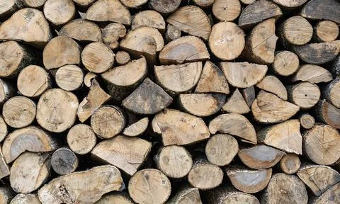 Stack of chopped firewood as an abstract background. 스톡 사진