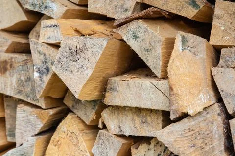 Stack of chopped firewood close-up, a blank for heating a house Stock Photos