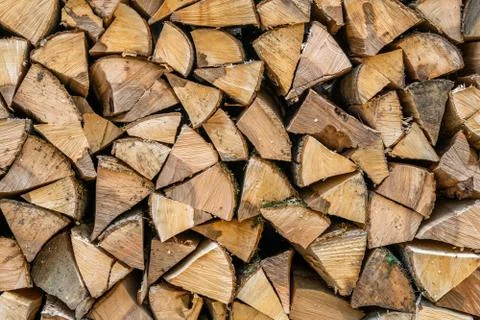 A stack of chopped firewood lies in the yard Stock Photos
