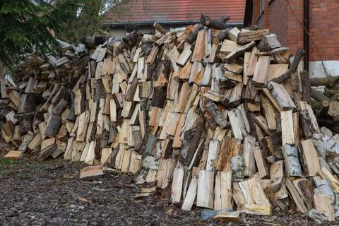 Stack of chopped firewood outdoors Stock Photos