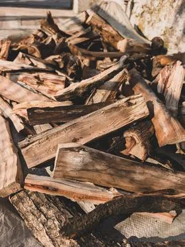 Stack of chopped firewood outdoors Stock Photos