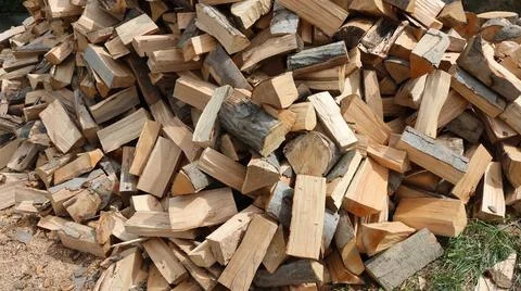 Stack of chopped firewood outdoors Stock Photos