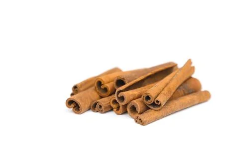 Stack of cinnamon sticks isolated on white background. Closeup, cinnamon Stock Photos