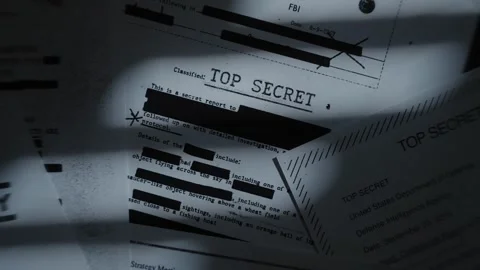 Stack of classified top secret documents and reports as camera pull up and spin Stock Footage 316317623