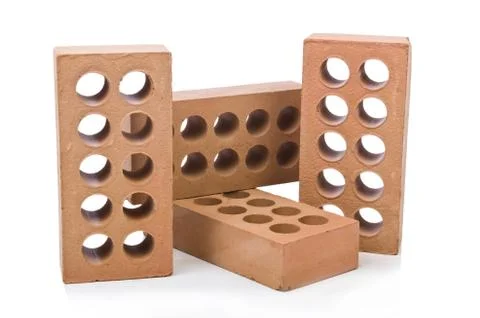 Stack of clay bricks isolated on white Stock Photos