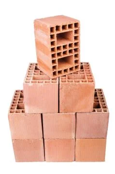Stack of clay bricks isolated on white Foto stock