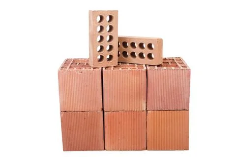 Stack of clay bricks isolated on white 写真素材