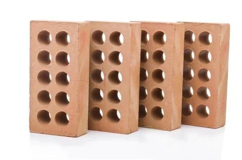 Stack of clay bricks isolated on white Stock Photos