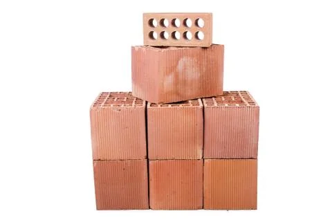 Stack of clay bricks isolated on white Stock Photos