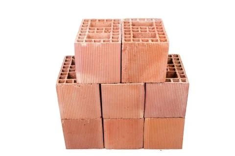 Stack of clay bricks isolated on white Stock Photos