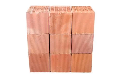 Stack of clay bricks isolated on white Foto stock