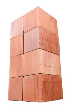 Stack of clay bricks isolated on white Foto stock