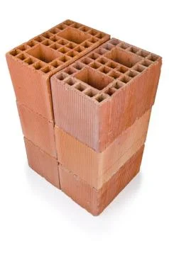 Stack of clay bricks isolated on white Stock Photos