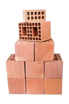 Stack of clay bricks isolated on white Foto stock
