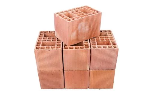 Stack of clay bricks isolated on white Stock Photos