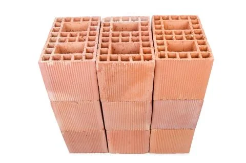 Stack of clay bricks isolated on white Stockfoto's