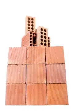Stack of clay bricks isolated on white Foto stock