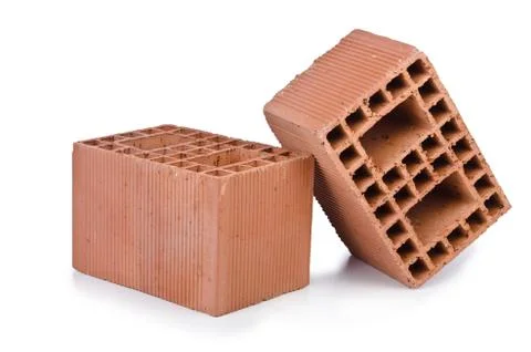 Stack of clay bricks isolated on white Foto stock