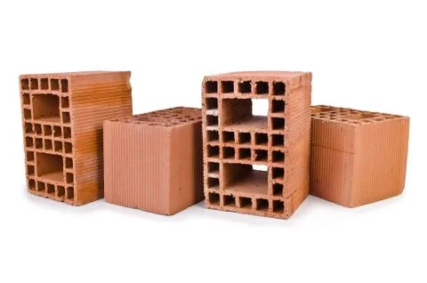 Stack of clay bricks isolated on white 写真素材