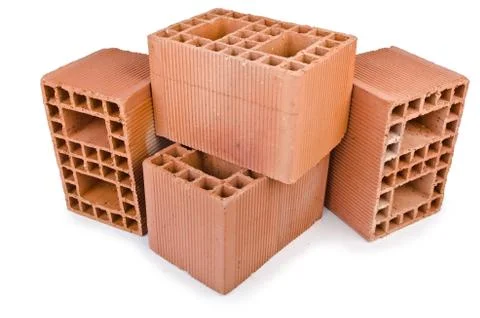 Stack of clay bricks isolated on white Stock Photos