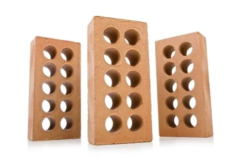 Stack of clay bricks isolated on white Foto stock