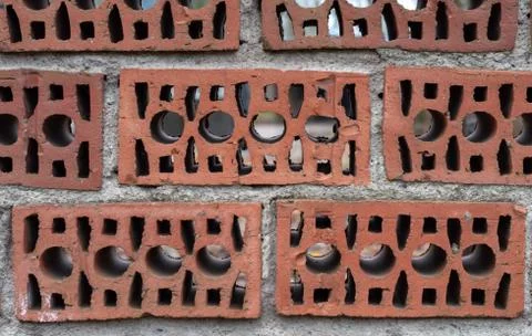 Stack Of Clay Masonry Bulding Blocks.Brick fence Foto stock