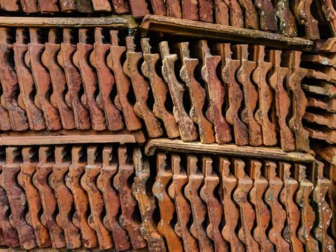 Stack with clay tiles that are worn out by time Stock Photos