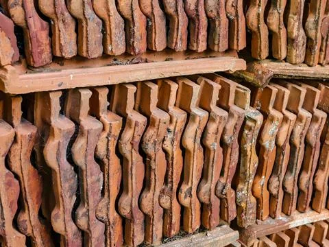 Stack with clay tiles that are worn out by time Stock Photos