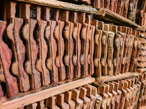 Stack with clay tiles that are worn out by time Stock Photos
