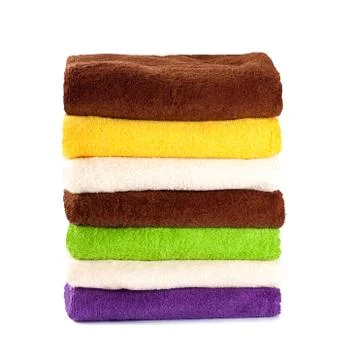Stack of clean fresh towels isolated on white background Stock Photos