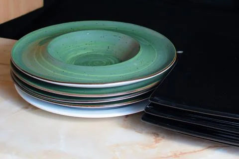 A stack of clean plates is on the table 写真素材