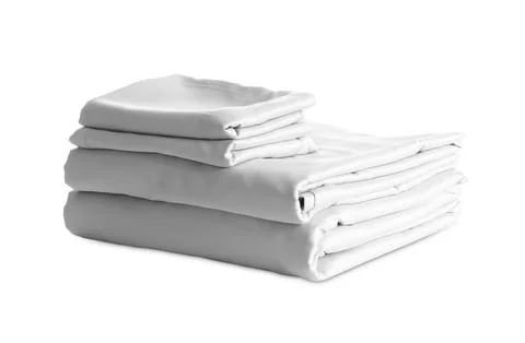 Stack of clean silky bed linen isolated on white 스톡 사진