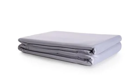 Stack of clean silky bed linen isolated on white Foto stock