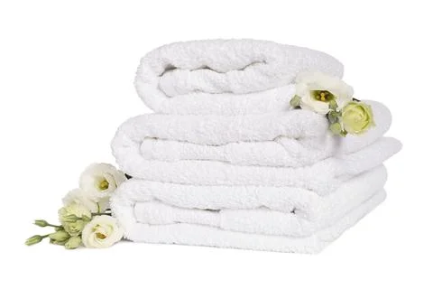 Stack of clean soft towels with flowers isolated on white Stock Photos