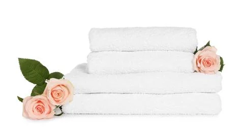 Stack of clean soft towels with flowers isolated on white Stockfoto's