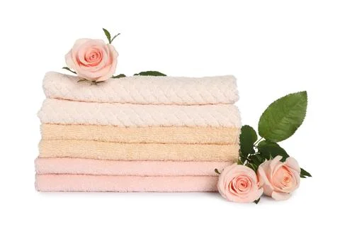 Stack of clean soft towels with flowers isolated on white 스톡 사진