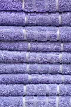 Stack of clean soft towels. ?otton lilac towels. Stock Photos