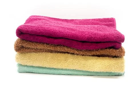 Stack of clean soft towels on white background Stock Photos