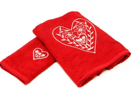 Stack of clean towels on bed Stock Photos