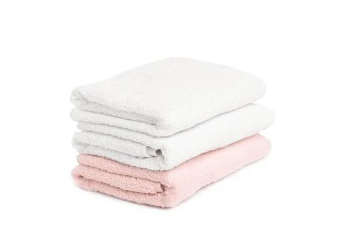 Stack of clean towels isolated on white Stock Photos
