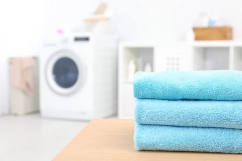 Stack of clean towels on table in bathroom.  Space for text 스톡 사진