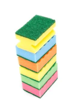 Stack of cleaning sponges on a white background. Stock Photos