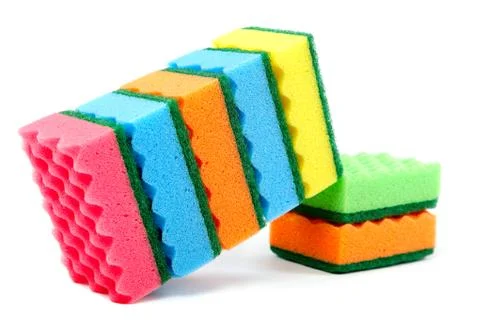 Stack of cleaning sponges on a white background. Stock Photos