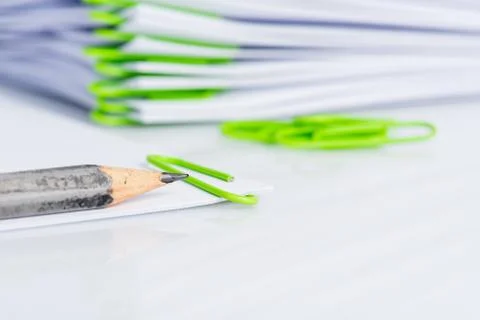 Stack of clipped blank paper sheet with pencil ready to make note close-up Stock Photos