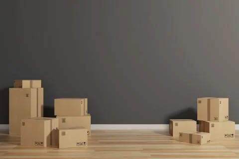 Stack of closed cardboard boxes wrapped with adhesive on the floor. Concept of Stock Photos