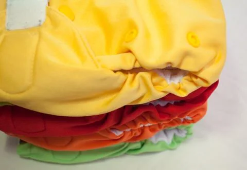 Stack of cloth diapers different colors Stock Photos