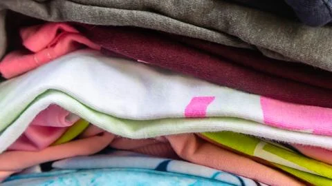 Stack of clothes as background Stock Photos